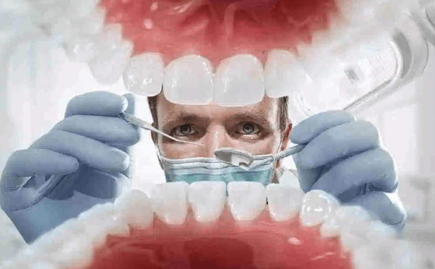 Image of doctor examine the teeth